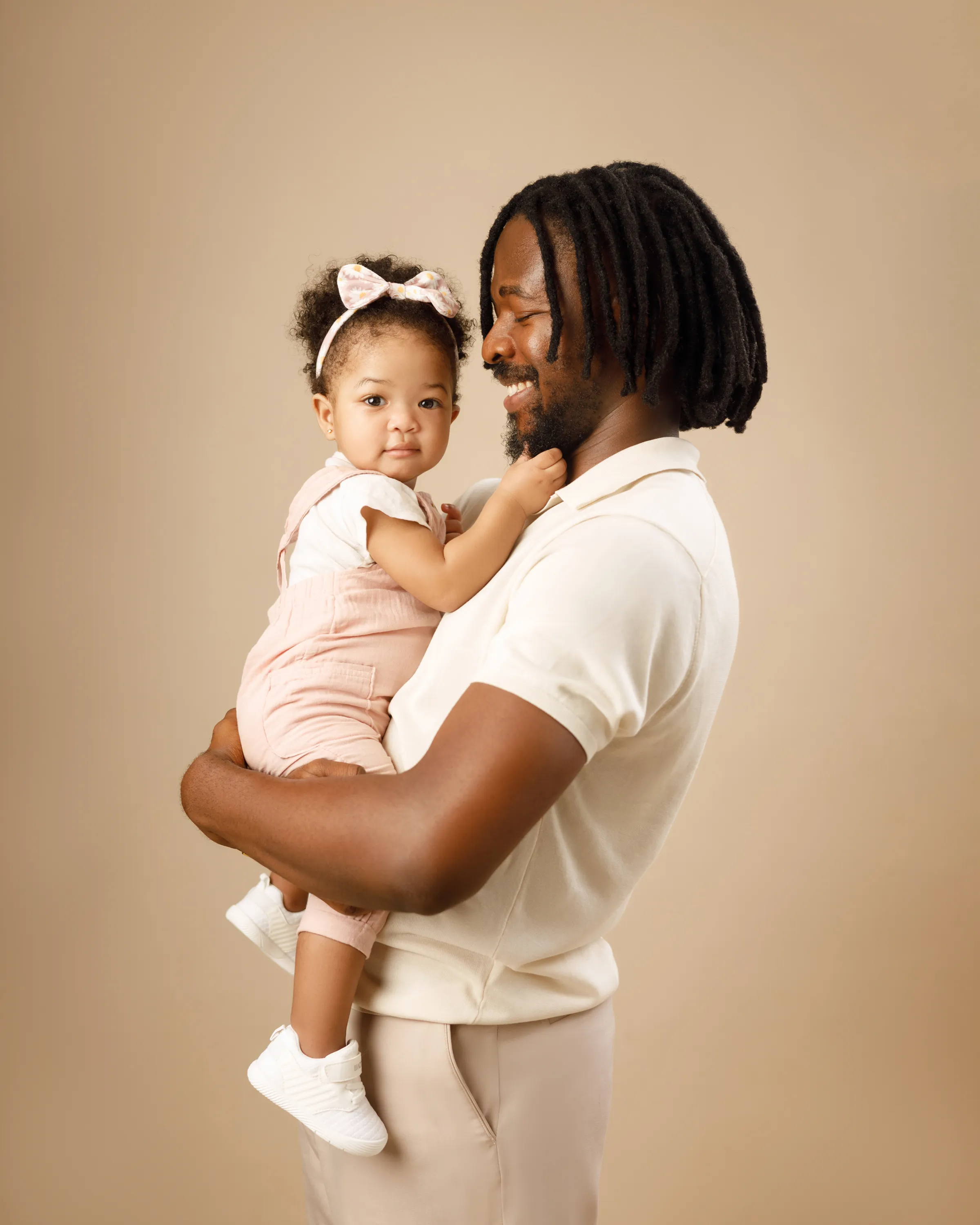 The Ighodaro family dressed in elegant traditional attire.
