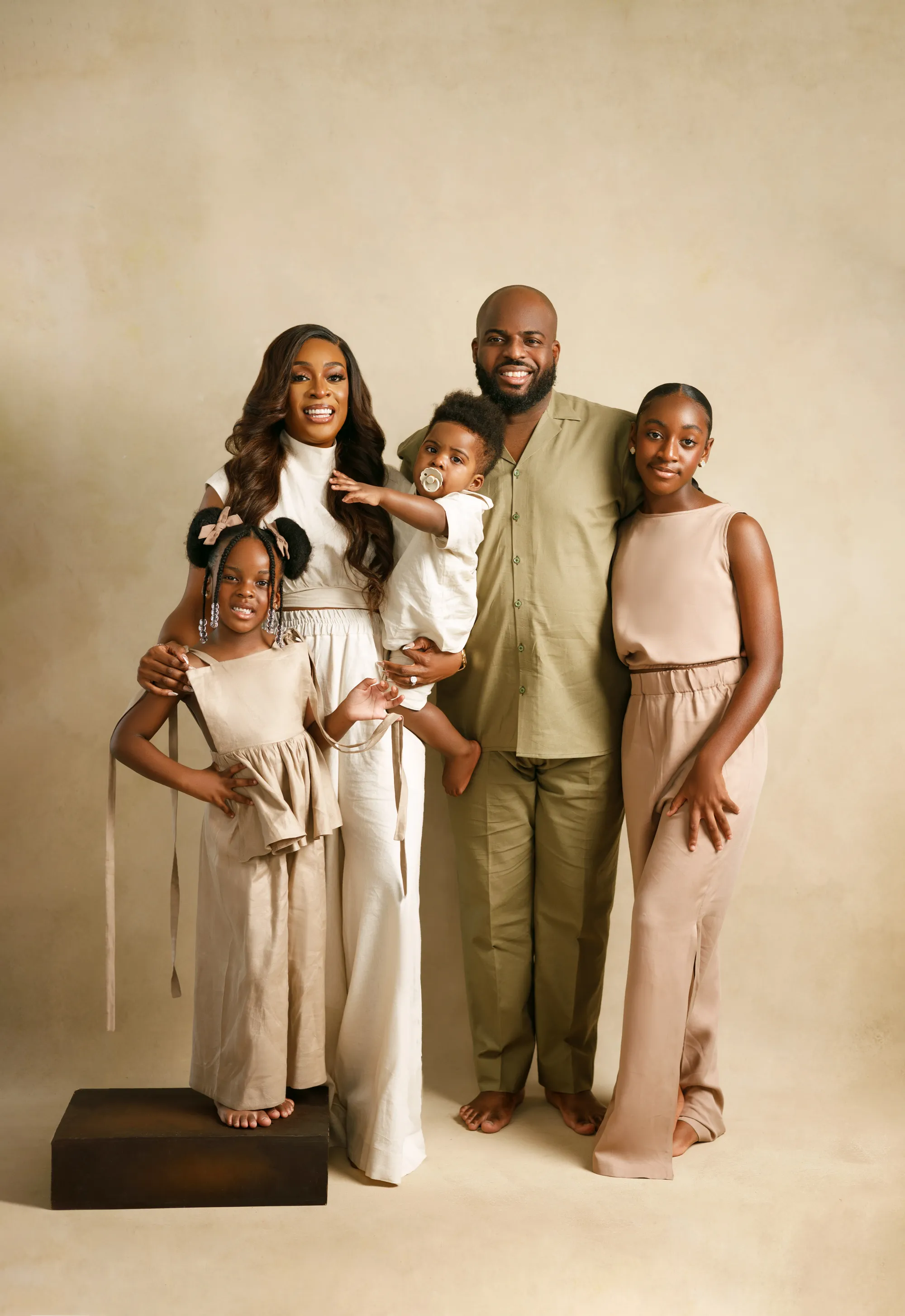 Close-up beauty portrait of Damilola with flawless skin and neutral makeup, Lagos studio.